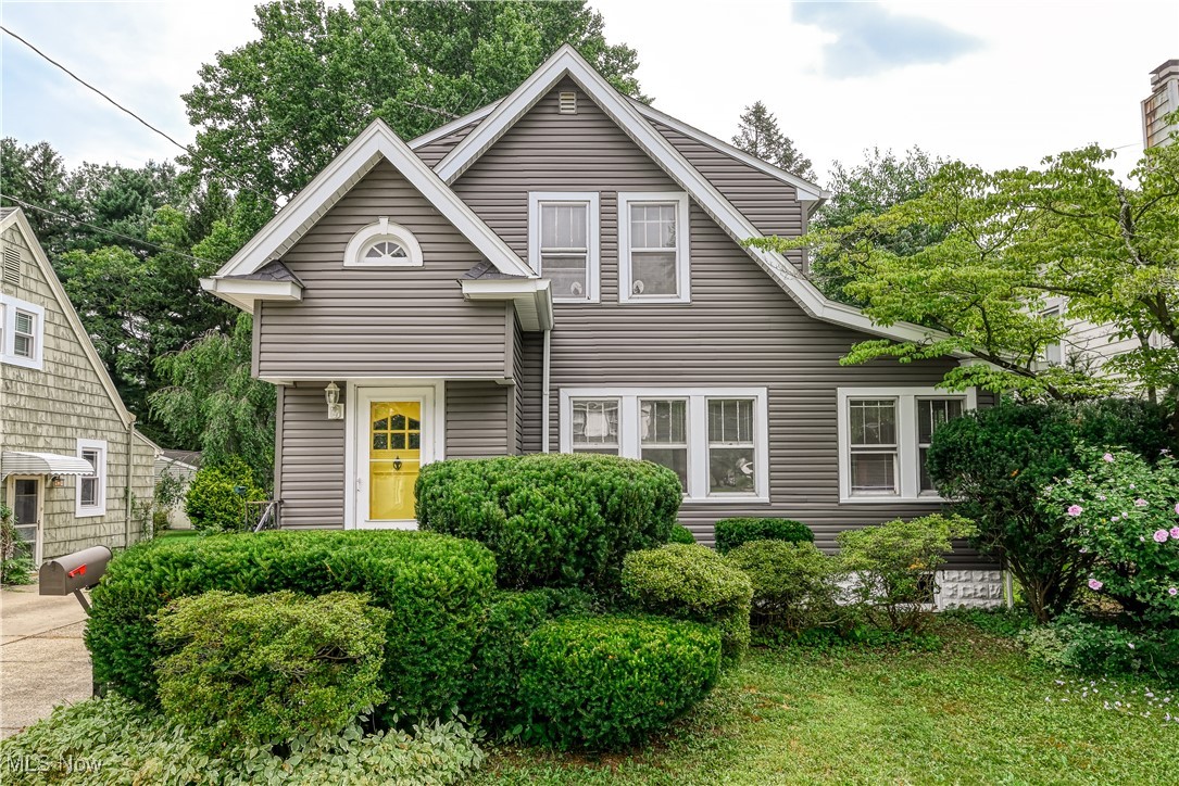 Timeless 1930 Colonial with modern updates and classic charm! Step inside to find hardwood floors that flow throughout the home, adding warmth and character at every turn. The spacious living room features built-in bookcases and opens to a versatile bonus room—perfect for a home office, playroom, or cozy reading nook. The formal dining room features a built-in window seat and a sliding door that opens to the newly stained deck, perfect for summer entertainment. The bright kitchen was completely remodeled (2020) with granite countertops, range, dishwasher, garbage disposal, and windows, blending functionality with thoughtful design. Upstairs, beautiful hardwood floors extend into each bedroom, all of which share a classic full bath. A second full bathroom in the basement was completely updated (2021), adding convenience and flexibility. Additional updates include: roof and A/C (2017), partial waterproofing (2018), furnace (2023), vinyl siding (2020), and a brand-new garage door (2025) on the extra-deep garage. The washer and dryer are less than two years old. All appliances are included in the sale. Located just minutes from Kent State University, Fred Fuller Park, restaurants, breweries, and more—this lovingly maintained home is the perfect mix of character, comfort, and convenience. Don’t miss your chance to make it yours!