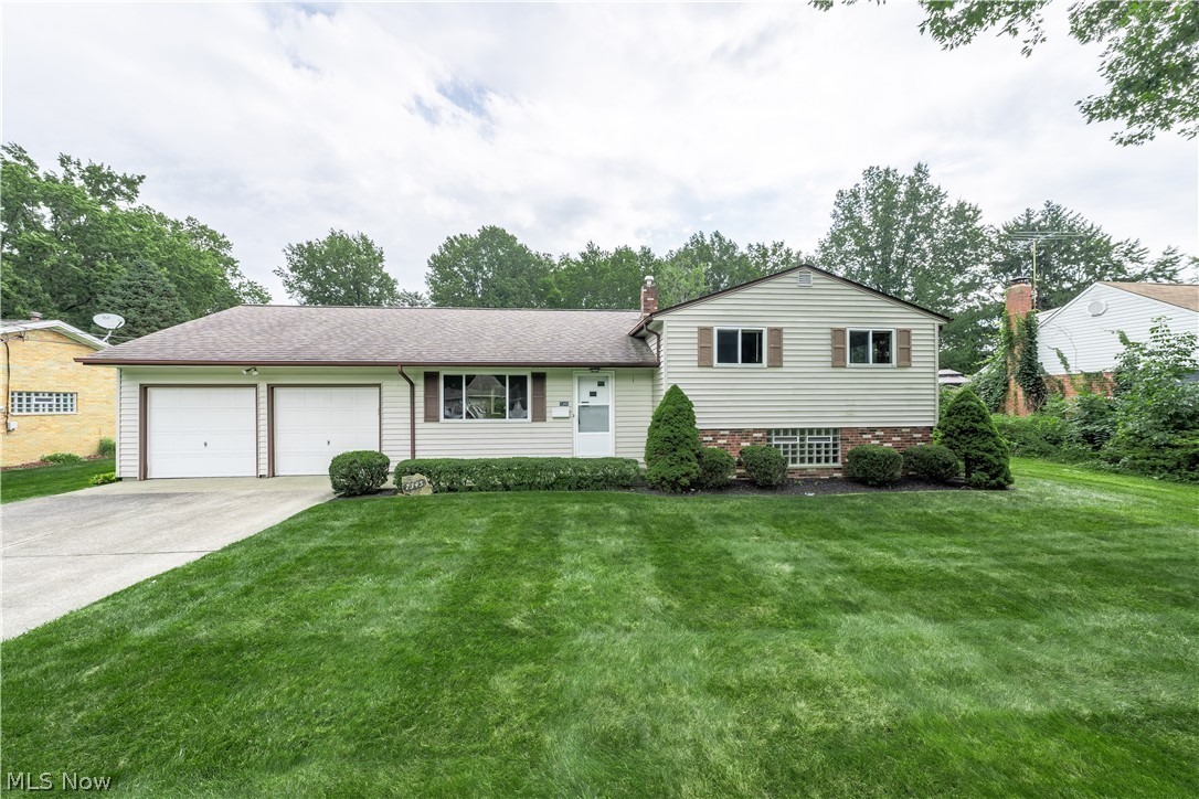 Welcome home to this impeccably maintained North Ridgeville Split-level! This home was built by the original owners (Dick Noll builders) and has been lovingly cared for. The home has 3 bedrooms and one and a half baths. The upper 3 bedrooms have beautiful hardwood floors. The Spacious Living and dining areas have neutral paint throughout and there are hardwood floors under the carpeting. The lower level, with a half bath and glass block windows, makes for great additional living space and has a large crawl space with storage! The large kitchen has a built in desk area, lots of cabinetry with a pantry for storage and all of the appliances stay! Imagine yourself sitting on the delightful back patio with your favorite beverage overlooking the big backyard! The home is completed by a 2 car garage with a large attic space above it for all of your storage needs! This home is located on a quiet dead end street. Please call for your private showing today!