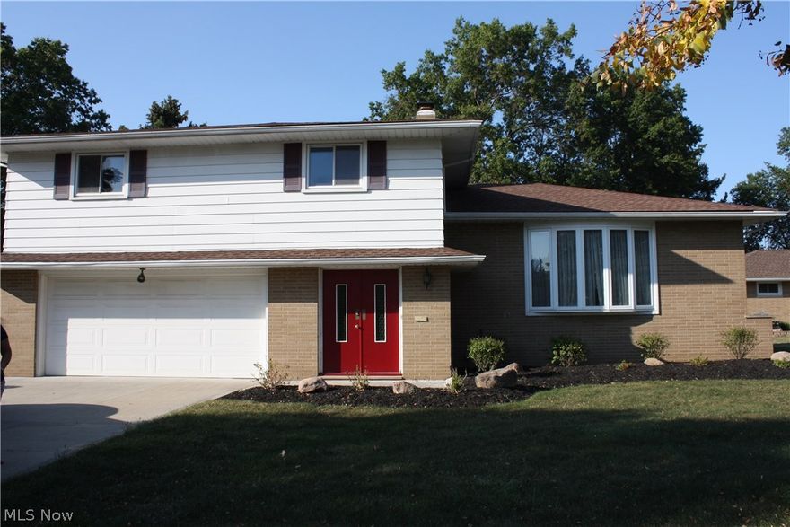 4 bedroom Split Level in gorgeous Seven Hills located in a quiet cul-de-sac. The home is close to a Cleveland Metroparks walking paths and has been recently updated, including new carpet in family room, fresh paint throughout the home, newly refinsihined hardwood floors, driveway and new windows (2006). The large master bedroom includes a master bath with Shower, there is 1 additional full bath upstairs and a ½ bath downstairs. 4 bedrooms upstairs which all include generous closet space. Eat-in kitchen with new appliances (cook top, double stove, and dishwasher) walks into the hardwood floor dining / living rooms. The basement is partially finished and includes a dry bar which is great for entertaining, as well as a wood burning fireplace in the family room. The oversized yard has endless possibilities with the very private large patio as well as a storage shed in the rear of the yard.  The patio also contains a natural gas hook-up for a stationary grill.