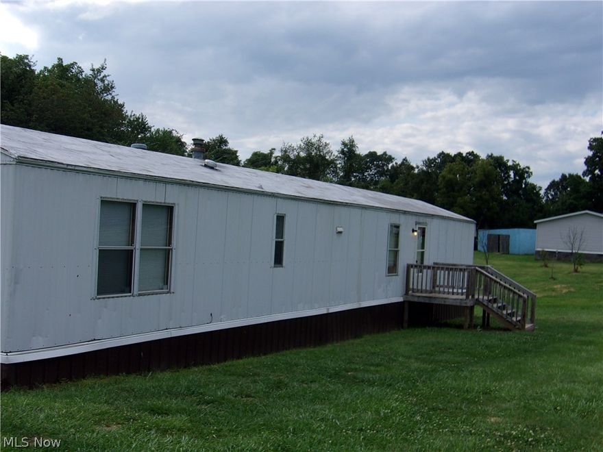 Country Delight! Wooded 13 acres with drilled well/septic-1996-14x70 well-kept mobile home with 2 bedrooms and 1 full bath. Open floor plan with large living room and eat-it kitchen. close to interstate for easy commutes! Additional Mobile home located on property owned by tenant, lot rent $125 monthly.