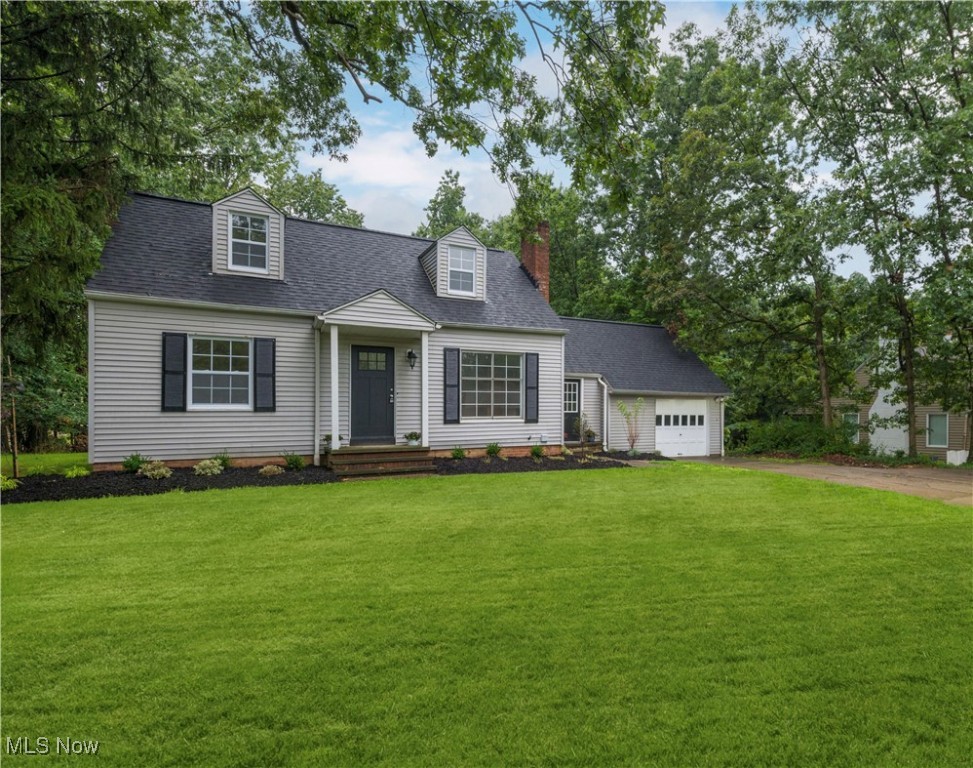 Welcome to 6431 Ridgewood Drive, a fully renovated 3-bedroom, 3-full-bath Cape Cod located in the heart of Parma. This beautifully updated home features a bright, open layout with laminate flooring throughout and ceramic tile in all bathrooms, offering both style and durability. The main level includes a spacious living room with a large picture window and a white-brick fireplace, creating a warm and inviting space. The kitchen has been completely remodeled and boasts granite countertops, white shaker cabinets, stainless steel appliances and a large center island that’s perfect for entertaining. The home offers a full bath on the main level, a primary suite with a full bath on the upper level, and a third full bath in the finished basement. The basement also includes a large recreation room complete with a wet bar, making it ideal for hosting guests or relaxing. A new washer and dryer are located in the fully finished basement, boasting 560sqft of livable space. Step outside to enjoy the expansive 20x40 deck that overlooks a private backyard surrounded by mature trees, providing a peaceful outdoor retreat. The property also includes an attached one-car garage and a brand-new electrical service panel box. Thoughtfully updated throughout, this move-in ready home is situated in a desirable neighborhood close to parks, schools, shopping, and major roadways. Don’t miss your chance to own this stunning home at 6431 Ridgewood Drive—schedule your showing today!