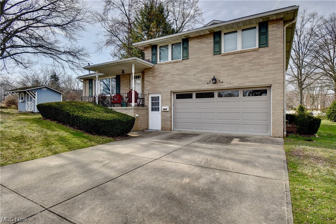 Welcome home to this charming all brick four level split in Lake Cable! Spacious well thought out floor plan offers living room, family room with a gas fireplace (2024) that leads to the large three season room which overlooks the beautiful backyard and stamped concrete patio (2020). The dining room is open to the bright, kitchen that offers a breakfast bar, range (2017), refrigerator, dishwasher (2021), and new recess lighting. Half bath. There are three bedrooms, and two full bathrooms upstairs. You can go through the garage to the basement which offers plenty of storage space, laundry area, and craft area etc. There is a she shed/man cave that has electric to it, and a work bench inside. Some updates include A/C (2019), smoke detectors, drainpipe leading from gutter replaced (2023), chimney recapped and inspected (2016). Lake privileges rights available for purchase! All you have to do is move in!