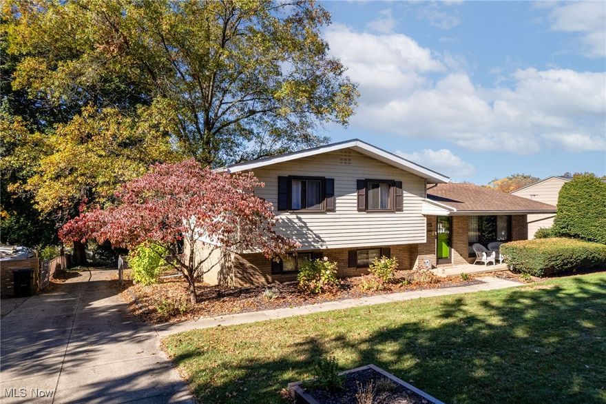 Welcome to this beautifully maintained 4 bedroom, 1.5 bath, charming split-level home, situated in one of Wadsworth’s most desirable neighborhoods. Step inside to find gleaming hardwood floors and a bright, open living and dining area perfect for everyday living or entertaining. The eat-in kitchen offers stainless steel appliances, ample cabinetry, and space for casual meals. Upstairs, you’ll find three comfortable bedrooms with hardwood flooring and a newly updated full bath. The lower level provides a cozy recreation room with a wood-burning fireplace, a fourth bedroom or office, half bath, and a convenient laundry area with a walkout to the backyard. Various built-ins throughout enhance the charm of this home. Recent updates include a newer furnace and central air (approx. 5 years old), as well as gutters and gutter guards replaced within the past 5 years, offering peace of mind for years to come. Outside, enjoy the covered front porch, mature landscaping, and a fenced yard — ideal for kids, pets, or relaxing evenings outdoors. The oversized attached two-car garage allows for additional storage space. Located within the Wadsworth City School District, this home is close to parks, shopping, dining, and major routes for easy commuting.