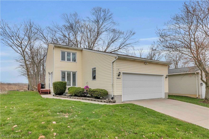 Welcome home to 144 Royal Crest Dr. in Seville.   This 3 bedroom, 2 bathroom cluster home is the one you have been waiting for!  Located in the desirable Seville Cluster Home community, this well-appointed home combines easy living with a peaceful setting. Positioned to capture scenic views and a private wooded backdrop, you’ll enjoy both privacy and the convenience of a community that handles landscaping and yard maintenance.  The layout is thoughtfully designed to accommodate a variety of lifestyles, featuring a spacious first-floor bedroom, full bath, and laundry—perfect for those seeking main-level living. Upstairs, you’ll find two additional bedrooms, a full bathroom, and a flexible loft space ideal for a home office, reading nook, or guest retreat.  Natural light fills the vaulted living room, creating an open and welcoming atmosphere. Sliding glass doors lead to a private deck where you can unwind and take in the tranquil surroundings. The kitchen offers generous cabinet and counter space, along with a center island and dining area that make everyday living and entertaining effortless.  You'll find plenty of storage with an attached two-car garage, and a full unfinished basement ready for your personal touch.  Notable features include newer windows, new flooring on the first floor and a waterproofed and reinforced basement.  Offering a rare blend of space, simplicity, and scenic views, this home is the perfect place to enjoy low-maintenance living without compromise. Don't miss this opportunity!  Schedule your private showing today