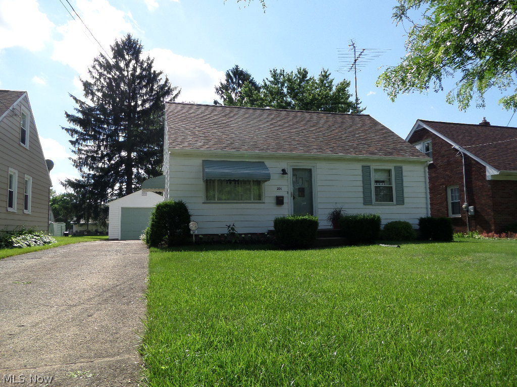 Neat, Cape Cod with kitchen, living room, 2 bedrooms, 1.5 baths, full basement with rec room, utility room, and workshop. Detached one-car garage. Unfinished second floor with room for another large bedroom and bath. H1-Efficiency/High Quality furnace and A/C, newer roof on house and garage, newer hot water tank, and appliances stay. Security system is owned.