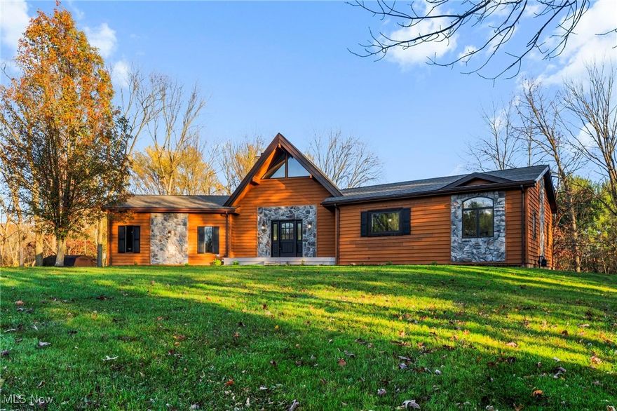 Welcome to this meticulously updated 4-bedroom, 3-bathroom home, offering over 3,100 square feet of beautifully finished living space on a picturesque & private 2.24-acre lot.

The front entryway opens to a large living room with floor-to-ceiling windows providing breathtaking views of the freshly painted wraparound deck, which leads out to a multi-level, secluded backyard, perfect for the nature enthusiast providing plenty of space to play & host gatherings. The living room also features a cozy modern fireplace with custom built mantel & vaulted ceilings, enhancing the sense of space & warmth.

Adjacent to the living room is a gorgeous updated kitchen with white shaker cabinetry, quartz countertops, a modern backsplash, brand-new stainless steel appliances, & a large island with seating. This bright, stylish kitchen flows into a spacious dining room, perfect for hosting & entertaining.

The main floor boasts a luxurious master suite with a large walk-in closet, & the spa like bathroom features double vanities, walk-in tiled shower, all new fixtures, & a beautiful free standing soaking tub that makes you feel like your surrounded by nature with all the natural light & natural design elements. 

The lower level of the home offers even more living space, with a family room that opens to the backyard, three additional generously sized bedrooms, & a second full bathroom with a new double vanity & a tub/shower combo with a tile surround & modern finishes. 

Other recent updates throughout the home include new lighting, paint, modern luxury vinyl flooring & carpet, new cabinetry, fixtures, new A/C, & refreshed landscaping. 

Conveniently located seconds to Bunker Hill & Shale Creek Golf Courses & just 10 minutes to downtown Medina & I-71. This home combines modern living with serene surroundings! Schedule a tour today!