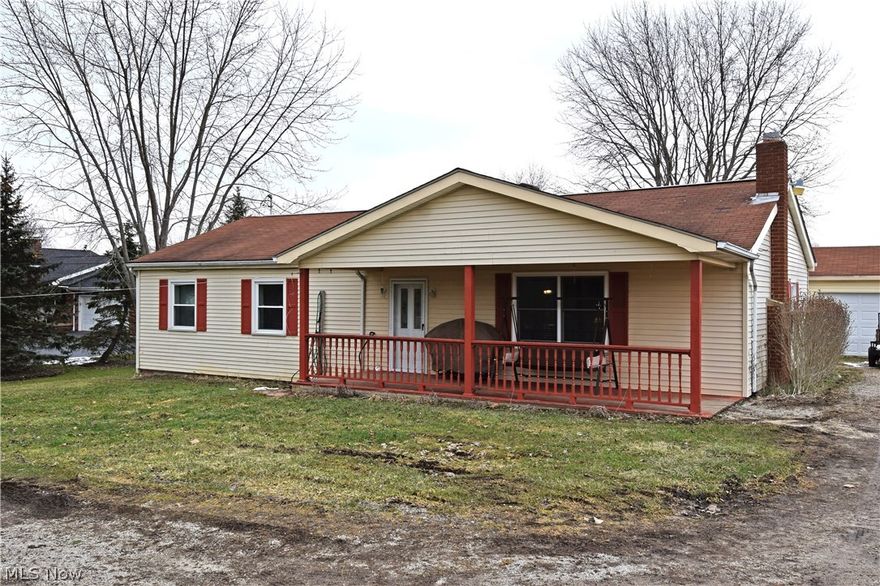 This move in ready three-bedroom ranch may be just the one you are looking for! Wide open space is key in this rural home set on a deep property, as the backyard seems endless. Inside the home, a bright and carpeted living room greet you at the door. Here, a brick accent wall featuring a fireplace creates a warm focal point for the room. A spacious kitchen and dining area open nearby, as dining is done in front of a set of sliding doors, providing a scenic view of the back patio. Hardwood style floors reflect the white walls and cabinets, giving a bright and inviting feel. Metallic tile backsplash pairs well with the stainless sink insert and accenting marbled countertop design. Three bedrooms can be found at the opposite end of the home. Each room provides carpeted flooring and ample living space. The main bath is oversized with a vast changing and shower area. Outside, a detached two car garage provides additional storage along with a utility shed.