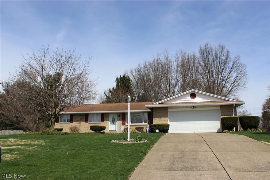 This pretty all brick ranch home is located in the beautiful neighborhood of Sherwood Village and has been loved by it's long-term owners for many years. It offers a large carpeted Living Room, which opens into the Dining Room, with a sliding door that leads out onto the concrete patio. The Kitchen cabinets have been refaced, and there's a handy counter area to pull up stools for a quick meal and an additional countertop area. All the Kitchen appliances will stay. There are 2 full 1st floor bathrooms, one in the Bedroom hallway, and one near the Family Room. Original hardwood floors are under the 3 Bedrooms, and the Master Bedroom has nice double closets. The rear walk-out Family Room features a wood burning fireplace, and a large picture window that overlooks the spacious, flat backyard. There is a lower level Retro-style Recreation room with an old-school Bar area, and a 2nd Kitchen with a gas stove, sink, cabinets and countertops. There's an abundance of closet space all throughout