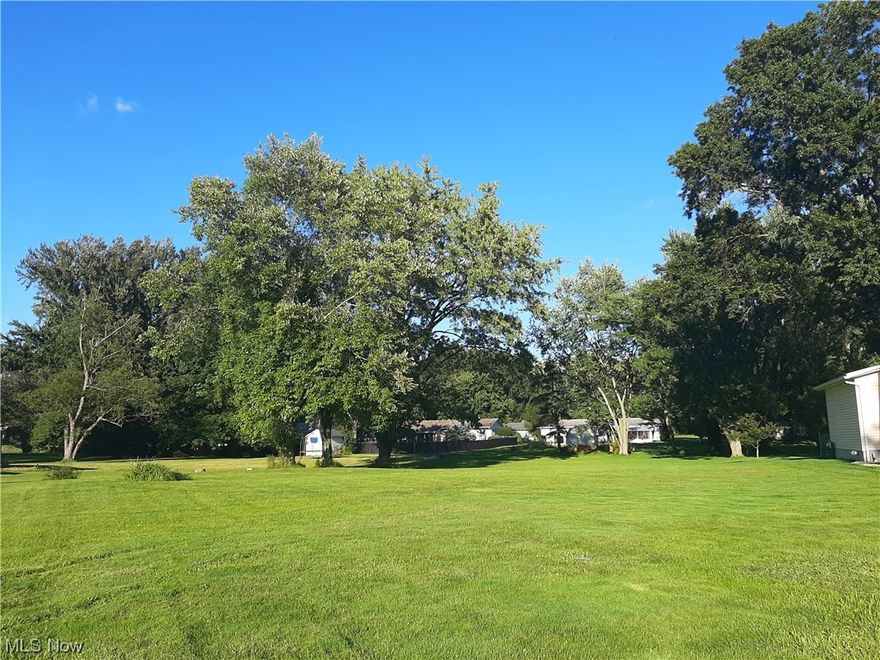 Nice, deep, flat lot to build your dream home! Tucked away on a quiet street that is close to the Portage Lakes, parks, shopping and other amenities makes this lot a picture-perfect spot for you! This established neighborhood is off the beaten path and in a highly desirable area.