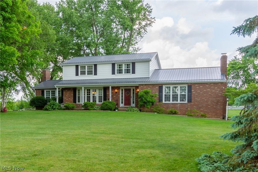 Beautiful 4 bedroom country colonial with separate in-law suite or home office! You will love the separate living areas, yet access to great family gathering areas. Nice open kitchen with room to spread out. This home has been immaculately cared for and offers many valuable updates. Roof replaced in 2014 with 40 year metal roofing! Windows have a lifetime warranty and were replaced in 2005. Gas boiler (Weil McLain) replaced in 2008. Siding replaced in 2016. Gas Hot water Heater just replaced in October 2017. New concrete driveway added in 2016! Do the math! That is over $50,000 in upgrades that you can appreciate for years to come! This home is nicely situated on nearly one acre of land with large fenced yard to the rear, shade trees, and just a beautiful location in Marlington Schools! You will love the economical average gas bills of $84.80/month and average electric bill of $50.08/month.  Come see for yourself!