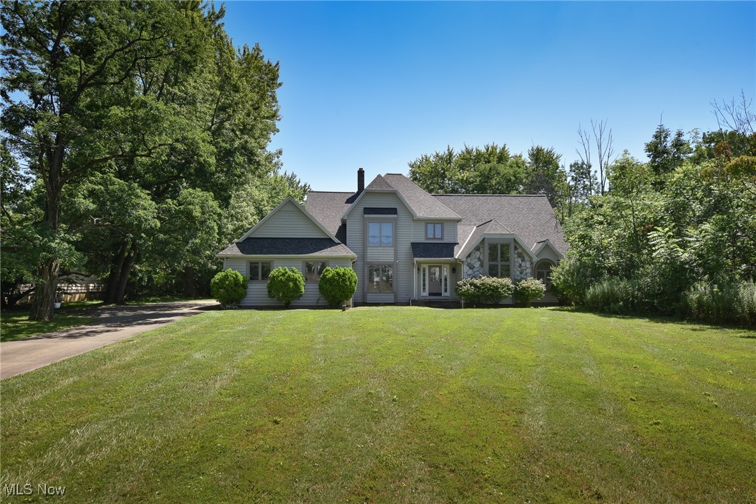 Welcome to this stunning 4-bedroom, 4.5 bath single family home in the highly sought-after Pepper Pike community. Perfectly located near top-rated schools and renowned hospitals, this residence blends elegance, comfort, and convenience. Step inside to find a thoughtfully designed layout featuring gleaming hardwood floors throughout the first floor and a spacious first-floor master suite with a massive walk-in closet for ultimate privacy and ease. The modern kitchen, complete with brand-new appliances (2024), flows seamlessly into the open living spaces. The inviting living room features a cozy gas fireplace, ideal for relaxing evenings. The centerpiece of the home is a vaulted great room, bathed in natural light and offering a warm, airy atmosphere for family gatherings. An additional first floor living room provides flexibility for a den, office, or media room. The formal dining room is perfect for hosting dinner parties, while a large mudroom area ensures practical functionality with abundant storage. Upstairs, you’ll find three generously sized bedrooms, each with ample closet space, along with a bonus room featuring an oversized closet—perfect for a playroom, craft room, or additional guest space. The finished full walkout basement expands your living options, offering a recreation room with a wood-burning fireplace, a full bathroom, and ample storage space, making it ideal for a home gym, office, or in-law suite. Recent updates include a new roof (2023), new HVAC system, and stylish new finishes throughout—ensuring peace of mind and true move-in readiness. Enjoy the tranquil Pepper Pike setting while remaining just minutes from premier hospitals, exceptional schools, shopping, and dining.