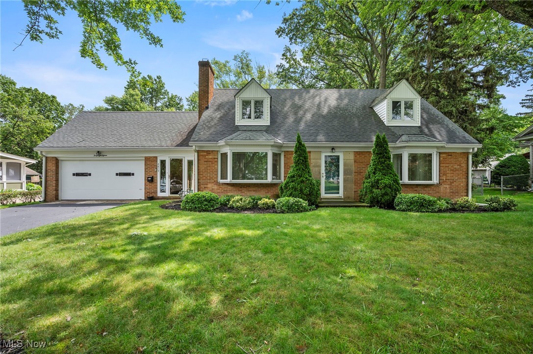 Don’t miss this beautifully maintained brick Cape Cod, lovingly cared for by long-time owners and ideally located just minutes from Historic Downtown Willoughby. Set on a spacious, landscaped lot, this charming home with a flexible layout with two bedrooms on the main level and two additional rooms upstairs, perfect for a home office, guest suite, or hobby space. The heart of the home features a spacious living room with a bay window and cozy fireplace, creating a warm and inviting atmosphere. It flows seamlessly into the formal dining room, where French doors lead to the backyard, perfect for indoor-outdoor entertaining. The home offers full baths on both the first and second floors, providing the flexibility of an owner's suite on either level. One of the main-floor bedrooms includes a laundry hookup, allowing for the option of convenient first-floor laundry if desired. A covered breezeway connects the home and garage, providing a shaded spot to relax, and leads directly to the adorable kitchen, making it the perfect place for morning coffee breaks or easy access when unloading groceries. The private backyard is peaceful and well-kept, ideal for gatherings, gardening, or simply enjoying nature. The walk-out basement features a finished recreation room, great for a media or game space, along with a dedicated workshop area and ample storage. Located in one of Willoughby's most desirable neighborhoods, this home is within walking distance to Downtown Willoughby’s shops, restaurants, and entertainment, and blocks from Daniels Park and Gully Brook Park. With easy access to I-90 and Euclid Avenue, commuting is quick and convenient. A rare opportunity to own a spacious, character-filled home in a fantastic location—schedule your private showing today.