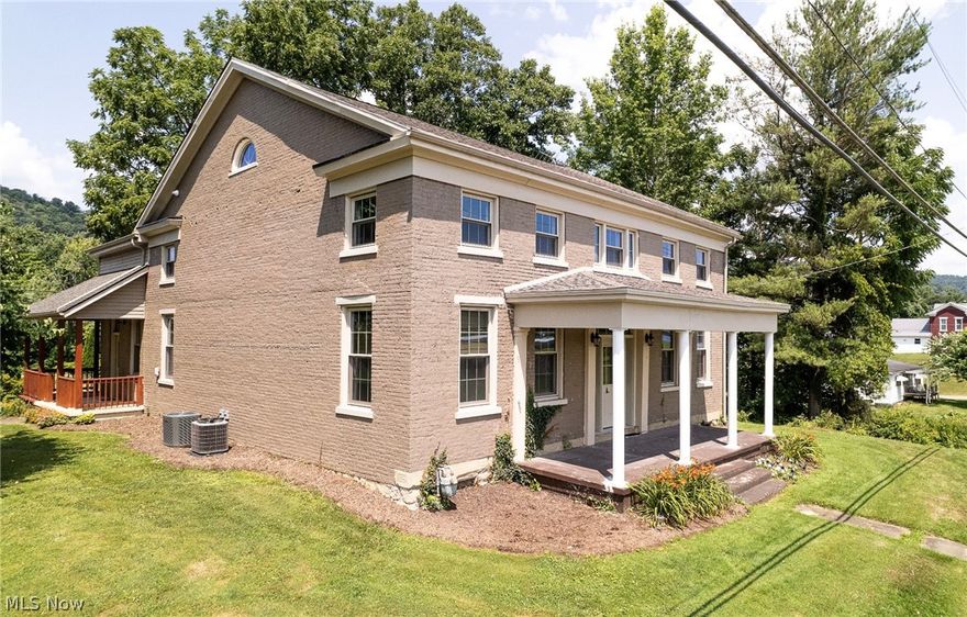 COMPLETELY REMODELED 1800s home with Views, Elegance and CHARM!!! This 6 bedroom, 3 bath home is situated on over 1.5 acres and with over 3500 sf of living space! Entertain your friends and family with 4 porches and a spacious open concept kitchen dining combo - - complete with three ovens, 2 sinks and a coffee bar! First floor bedroom and bath.  The master suite is positioned only a few steps away from the upper living area - - with a private bath, vaulted ceilings and a large heated walk-in closet! Abundant natural light and neutral colors throughout. Outside boiler for additional heating and efficiency! Circle driveway with ample parking among mature landscaping + additional flat yard at back of property that would be great for more garage space or an in-ground pool! NEW:  windows, 2 furnaces, 2 central air units, electrical lines, gas lines and water lines to home and throughout! Call today to tour this modern, yet classic gem!