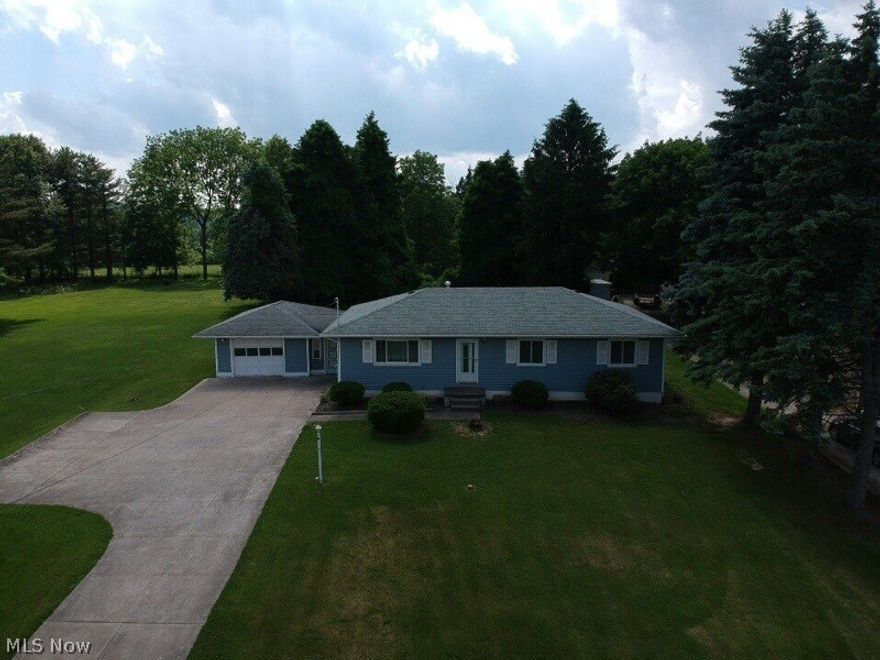 Welcome home to this one owner, three bedroom and one and a half bathroom ranch. The kitchen offers a great breakfast bar, along a separate dining area. The living room is off the entry way with a nice coat closet. The half bedroom is attached to the master bedroom. The poured foundation provides a dry and secure basement that is ready to be finished. The three season breezeway attaches the garage. Outside you will find a fully paved driveway with a turnaround, perfect for traffic and some basketball. Out back you will find a couple of patios waiting for some fires and smores. Sitting on just under an acre you will find plenty of privacy. This property is located in the Wadsworth School District and does have school bus pick up.