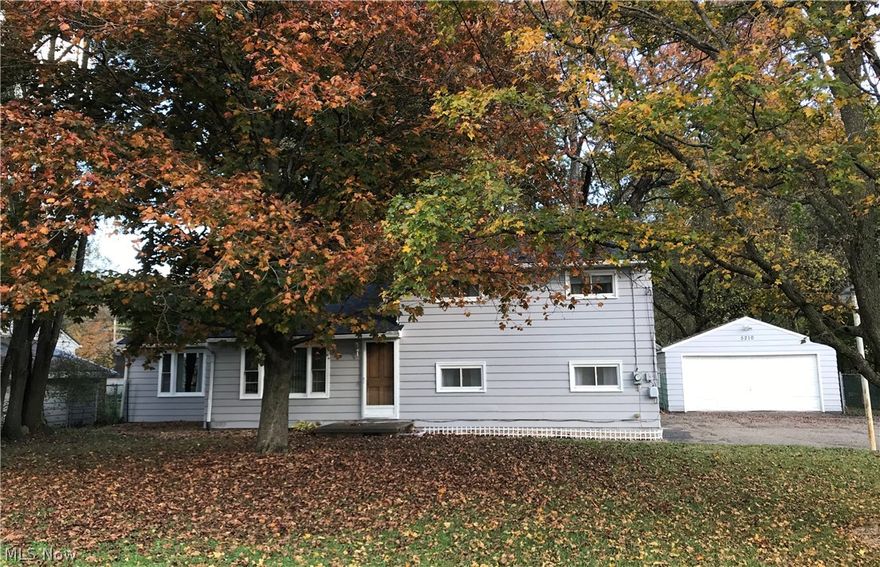 Well cared for three bedroom split level in Jackson Township - Jackson Schools! Front door entrance brings you into a roomy living room with the lovely large picture window bringing in a lot of natural light. Walk on through into the large eat in kitchen which has brand new beautiful, waterproof, woodgrain, vinyl plank flooring, September 2020. Plenty of cabinets for storage, ample counter space with updated laminate surface and breakfast bar. Dining room features another large window along with access to the backyard. All 3 nice-sized bedrooms on second level have new carpet, 2019. The large sunken family room is carpeted and cozy. Large, two car detached garage. Nearly half acre of treed lot is fully fenced in the back. New roof Oct. 2019. This home is priced to sell! Call for your private showing today.