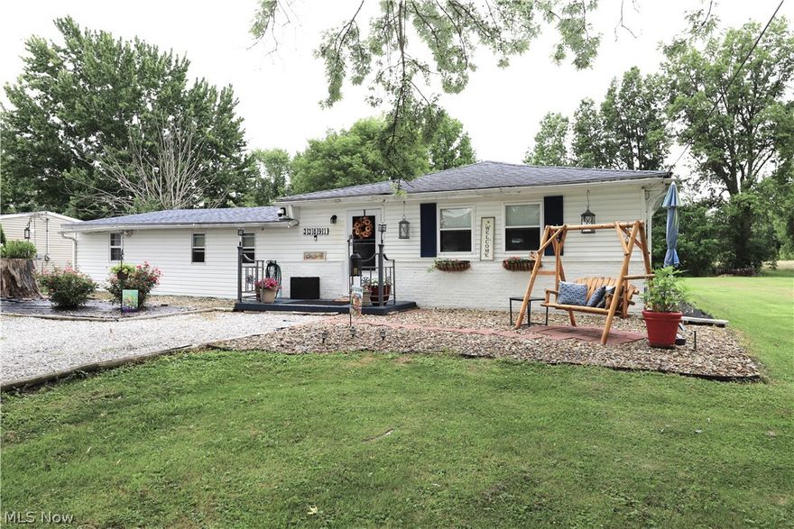 Welcome Home to this charming Ranch nestled on an extra large lot with beautiful landscaping. (2 parcels convey)  As you enter the home, you will be greeted with a cute nook and spacious Living Room.  Family Room/Dining Room combination with pellet stove. Eat-in Kitchen offers loads of cabinet space & appliances which goes out to the canopy covered deck area.  Updated full baths, one has a jetted tub & the other one has a shower.  Tankless hot water heater. Large Laundry Room. Owner's Bedroom could easily have a closet put back in-owner uses Bedroom #2 as a walk-in closet.  Generator and & lawn mower to stay.  Carport with attached shed plus another additional shed.  Roof on left side of home was redone 2021.  Home is in need of some TLC.  Seller selling "as is", seller will do no repairs.  (Back on market-NO inspections were done, buyer walked-seller is installing new electrical panel & placed new gutters on home & re-did laundry floor-see disclosures)