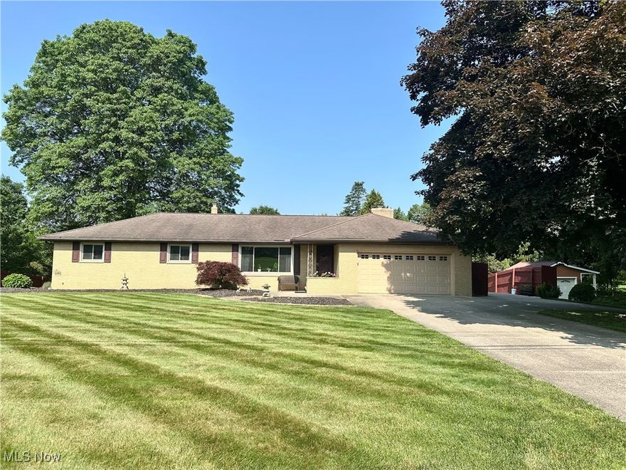Welcome to this beautifully maintained brick ranch in sought-after Springfield Township area! Offering over 1,749 sq ft of comfortable first-floor living, this versatile home boasts a spacious living room with ceramic tile entry and coat closet, a stunning kitchen with recessed lighting, full appliance suite, and a breakfast bar that opens seamlessly into the family room—featuring a cozy wood-burning fireplace and french doors leading to a charming side porch. Enjoy meals in the formal dining room or casual gatherings in the open-concept living areas.
The primary suite features a private bath with shower, while two additional generously sized bedrooms share a second full bath complete with double sinks and a jetted hot tub with waterfall feature. Convenient main-floor laundry is located in the attached 21x23 garage.
Downstairs, the 90% finished lower level adds approximately 1,269 sq ft of living space with its own kitchen, dining and living areas, a bedroom, full bath with shower, second laundry/utility room, and walk-out access to a private concrete patio—ideal for multi-generational living or a potential in-law suite.
Set on a beautifully landscaped 0.77-acre lot with retaining wall flower beds, this property also includes a 26x26 heated 2-car detached garage. A rare opportunity for flexible living with easy access to highways, shopping, and more. This is one you don’t want to miss!