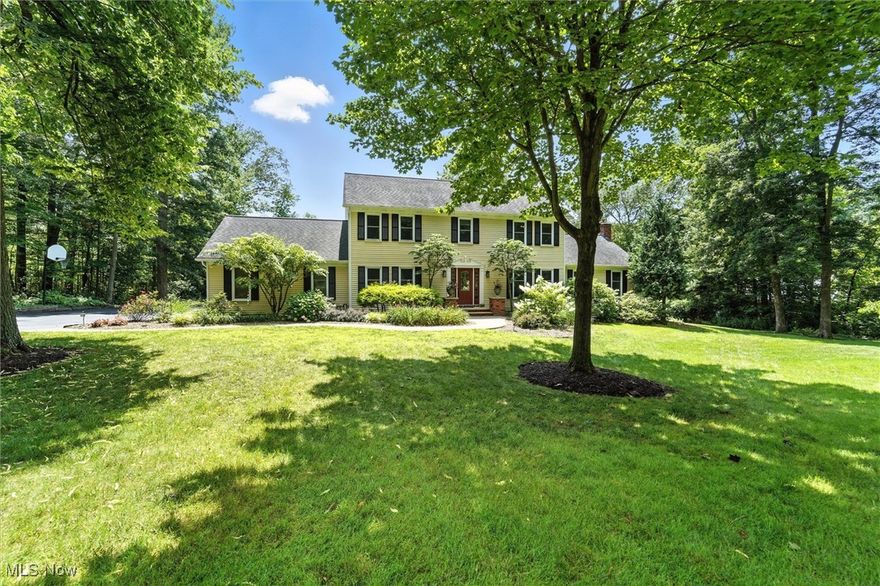 Set on 2.5 acres of exceptional property, this beautifully updated and meticulously maintained colonial offers the perfect blend of luxury, function, and natural beauty. Located in the desirable Arbor Trail neighborhood, this home features 5 bedrooms and 2 1/2 baths with thoughtfully designed spaces inside and out. The gourmet kitchen is a chef’s dream—complete with granite countertops, a garden window, built-in desk, double ovens, gas cooktop, and abundant cabinetry. The inviting living room boasts a fireplace and natural light, while the formal dining room features hardwood flooring, perfect for entertaining.A first-floor bedroom is currently used as a home office, and the mudroom includes a utility sink and custom storage, conveniently located off the 3-car garage with epoxy stone flooring. Upstairs you’ll find a spacious primary suite with a luxurious, fully renovated bath featuring a soaking tub, tiled walk-in shower,  a generous walk-in closet and a custom barn door. The second level also includes a laundry area, three additional bedrooms—one with custom built-ins ideal for a study or workspace—and another full bath. The finished lower level includes a large family/recreation room, a home gym or play area, a workshop, and ample storage. Enjoy the bright and airy sunroom with three sliding doors opening to a sprawling deck—complete with a gazebo and a built-in slide—designed for entertaining. Outdoors, you'll find a peaceful porch swing on the outbuilding, a fire pit area, walking paths, and four scenic ponds stocked with Bluegill and Bass for fishing and swimming. The grounds also feature fruit trees (apple, peach, cherry), grapevines, garden areas and lush landscaping—providing beauty and bounty year-round. A truly special property offering comfort, charm, and countless opportunities to enjoy nature in your own backyard.