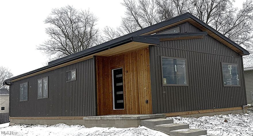 This newly built, ranch home is 85%complete and will be finished soon! Open floor plan, vaulted ceilings and ADA friendly, why shop resale when you could have band new EVERTHING! Front porch, soffits and trim are constructed of Lunawood. A thermally modified, sustainably grown wood that is weather and rot resistant. It's sleek design and vertical installation gives a luxury feeling without the luxury price tag. The two car garage has an 8' foot door, so you could fit a taller truck or van without worry. Schedule your appointment today to tour your dream home. Construction is ongoing, new pictures will be posted as they are available. Cabinets and granite countertops, black with a leather finish to be installed in the next two weeks.  Last update on 12/6/2025. Fifteen year tax abatement available.