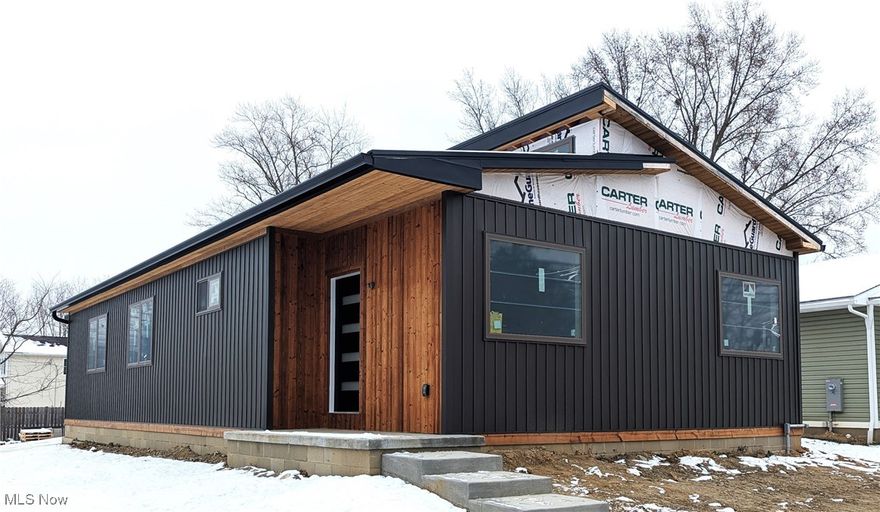This newly built, ranch home is 85%complete and will be finished soon! Open floor plan, vaulted ceilings and ADA friendly, why shop resale when you could have band new EVERTHING! Front porch, soffits and trim are constructed of Lunawood. A thermally modified, sustainably grown wood that is weather and rot resistant. It's sleek design and vertical installation gives a luxury feeling without the luxury price tag. The two car garage has an 8' foot door, so you could fit a taller truck or van without worry. Schedule your appointment today to tour your dream home. Construction is ongoing, new pictures will be posted as they are available. Cabinets and granite countertops, black with a leather finish to be installed in the next two weeks.  Last update on 12/6/2025.