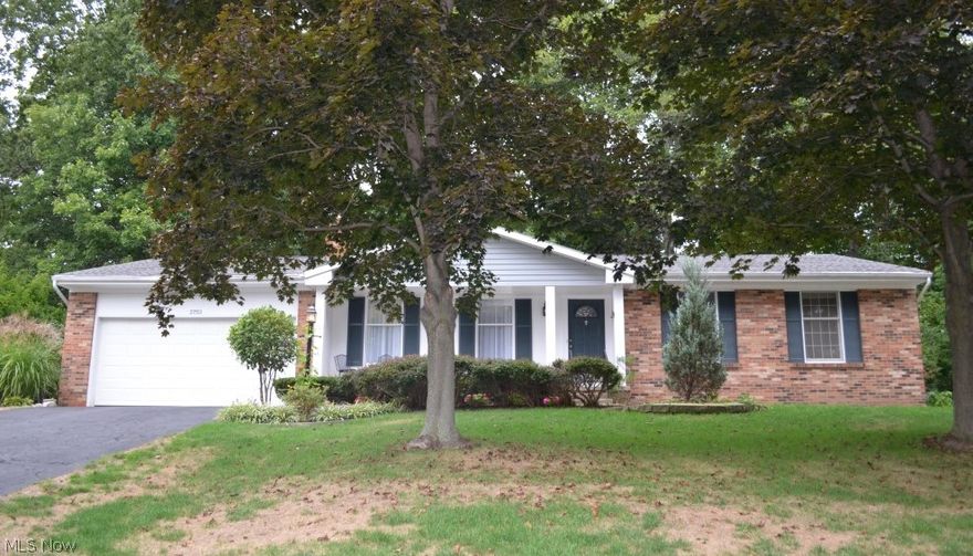 Wonderful ranch home, perched on slight hilltop, with numerous amenities throughout.  Inviting, covered front porch leads to welcoming foyer with gleaming hardwood floors.  Spacious formal living room features mantled fireplace, chair molding, and hardwood floors.  Elegant formal dining room boasts hardwood floors and access to sun room.  Vaulted sun room with ceiling fan and sliders to patio.  Bright, eat-in kitchen offers all appliances, extensive cabinetry, bay window, and overlooks family room.  Engaging, sunken family room highlights floor to ceiling, brick fireplace, custom built-ins, crown molding, and sliders to patio.  Master suite features glamour bath with jetted tub, separate shower, and double vanities.  Two additional bedrooms, with hardwood floors, and main full bath.  Lower level recreation area.  Furnace (2004).  Roof (2006 - 30 yr. shingle).  A/C (2010).  Brick patio.  Fenced backyard.  Two car attached garage.