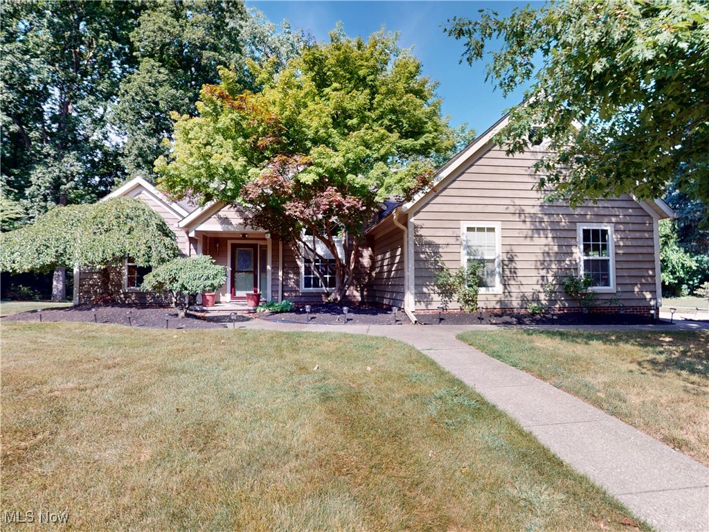 Welcome Home! Tucked away on a peaceful cul-de-sac and surrounded by a wooded setting, this beautifully designed 3-bedroom, 2-bath ranch offers comfort, style, and convenience all in one. From the moment you step inside, you'll be greeted by soaring ceilings, an open-concept floor plan, and a striking three-sided fireplace that warms both the living and dining areas. The formal dining room, just off the entry, could also serve perfectly as a home office. The spacious eat-in kitchen is truly the heart of the home, featuring a large pantry, abundant cabinetry and counter space, a butler's area, and direct access to the patio for grilling and relaxing while surrounded by nature. The split floor plan ensures privacy, with two large bedrooms and a full bath on one side, while the serene owner's suite is set apart and boasts double sinks, a soaking tub, walk-in shower, and private water closet. Additional highlights include a laundry/mudroom off the 2.5-car garage, and a prime location close to the marina, yacht club, shopping, dining, theaters, and easy freeway access. So much to offer!