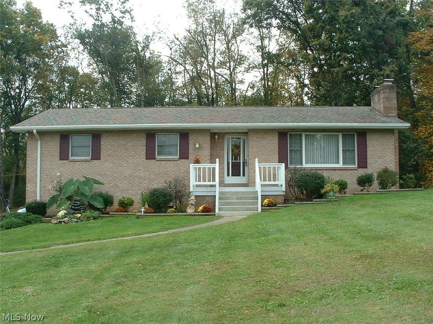 Gorgeous brick 3 BR, 2 1/2 BA home with everything you need for comfortable living. Amazing curb appeal will lead you to the entrance of this immaculate brick home. Once you enter you will see the beautiful living room with newer carpet, stone gas fireplace and a picture window for plenty of natural light. The living room flows into a formal dining room with a view through newer Pella french doors. Through the french doors you will walk onto a very large deck and into a back yard that begs for family and friends to entertain. The dining room also leads into a kitchen that you will love, with newer stainless (gunmetal finish) smudge-less appliances and a large counter area with convenient seating for less formal meals. A few steps away you will find a full bath, 3 bedrooms with refinished hardwood oak floors and large closets. The master bedroom has it's own half bath. The bottom floor of this raised-ranch has another full bath, a laundry room and a warm and inviting family room with ne