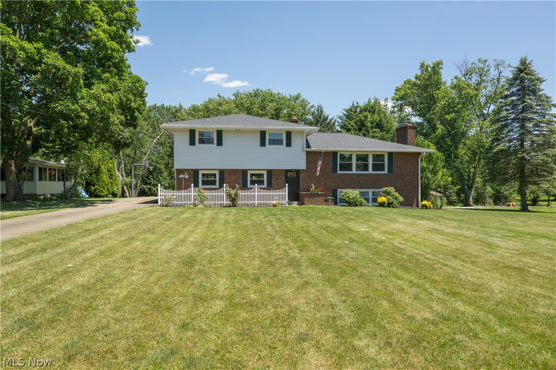 Perry Township split level offering 4 bedrooms, 3 full baths, & 2,106 square feet and situated on a 1.05 acre lot with trees creating privacy. Enter the home through the foyer with a beautiful slate floor which leads to formal living room with gas fireplace. The oversized kitchen features lots of counter space and storage. There is a sliding door which leads from the dining room to a screened in porch. There are 3 bedrooms including the master bedroom on the second floor. The master bedroom has a full bath and shower. The main bath has been recently remodeled with a walk in shower. The lower walk out area of the home has the the fourth bedroom, full bathroom, laundry room, and family room with wood burning fireplace. Lower level family room has supplemental baseboard heating. Home also has a 2 car garage that is both heated & cooled. Other updates include windows 2022, roof 2023 and appliances in 2021. You will not want to miss seeing this house!