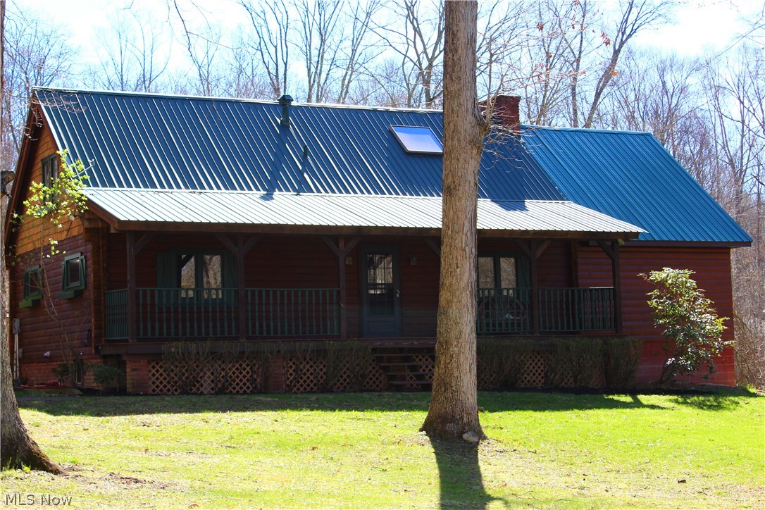 Vacation every day in this beautiful log style home. This 3 bedroom, 3.5 bath home has many updates throughout. Newly added master bedroom with handmade sliding barn door and master bath offering dual sinks, tile shower and nice closet space. The first floor is also home to an additional bedroom and full bath. The upstairs loft is complete with bath and bedroom with a skylight for falling asleep under the stars. The living room has soaring ceilings with skylights and a gorgeous brick fireplace. Private wooded lot with huge deck and hot tub on rear of home. The front of the home offers a cozy porch. All bedrooms essentially have their own bath area. Detached garage (38x28) with new door. Full unfinished basement perfect for storage or finish for additional living space.
Walking distance to Dillon Park area. Move in condition and so much character and charm take a look today!