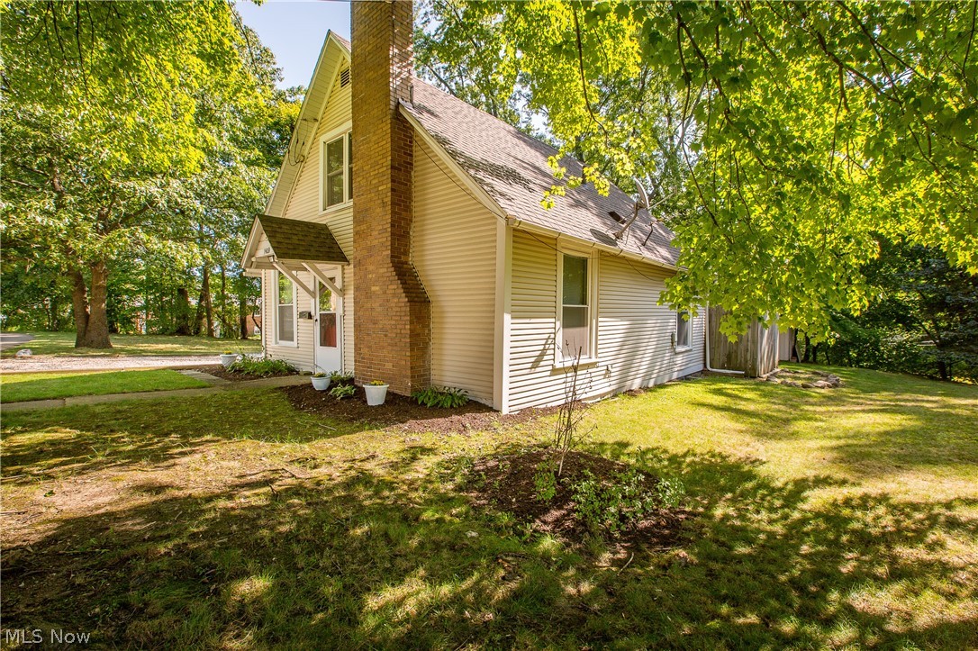 Completely Updated 1.5 Story *GEM* in Cuyahoga Falls, Such a Rare combination of Updates and Affordability will surely go Quick in Cuyahoga Falls! Enter the rear of the home, past your Elegantly Lit Patio, in to the Eat-in Kitchen, Highlighted by New Cabinetry, Countertops, Tile Backsplash AND Flooring! A Beautiful Garden Window Lets in an Abundance of Natural Light. Off the Eat-in kitchen is the 1st Floor Bedroom outfitted with Fresh Hardwood Flooring, continue down the hall where you'll find the Full Bath, and just beyond that is the over-sized Living Room, spanning the width of the Home! The Living Room flaunts Newly Refinished Hardwood Flooring and a Beautiful Fireplace! Upstairs You'll Find the other 2 bedrooms, complete with Plentiful Closet Space, Brand New Carpet, Doors, and a Fresh Coat of Paint. Boiler Replaced and radiators updated in 2016, H2O Tank replaced in 2017, Roof and Windows replaced 2007, Siding 2006 (Dates Approximate). Just blocks from Metro Parks, Shopping, Dini