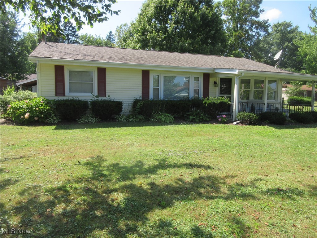 Summer Cottage nestled on .30 acres, with a lake view. Three bedrooms, one bath, large living room, and large sunroom. Two car detached garage.