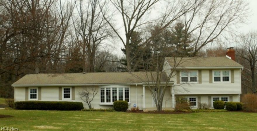 See this impeccable 2067 sq.ft. home on almost a 3/4 acre park like setting in N.E. Massillon. The first floor features a large living room with bow window and fireplace, dining room, updated kitchen and new half bath, all in neutral colors. Upper level has 3 bedrooms with wood floors under the carpet, full bath and loads of storage. The walk out lower level has a large family room with a wood burning fireplace, shower room and laundry room. The patio overlooks a large private back yard. The many updates in this home include  brand new a/c 2014, furnace, siding and roof 2004, replacement windows 2003. This home includes a home warranty. Priced to sell! 
Great curb appeal, call today to view this lovely home.