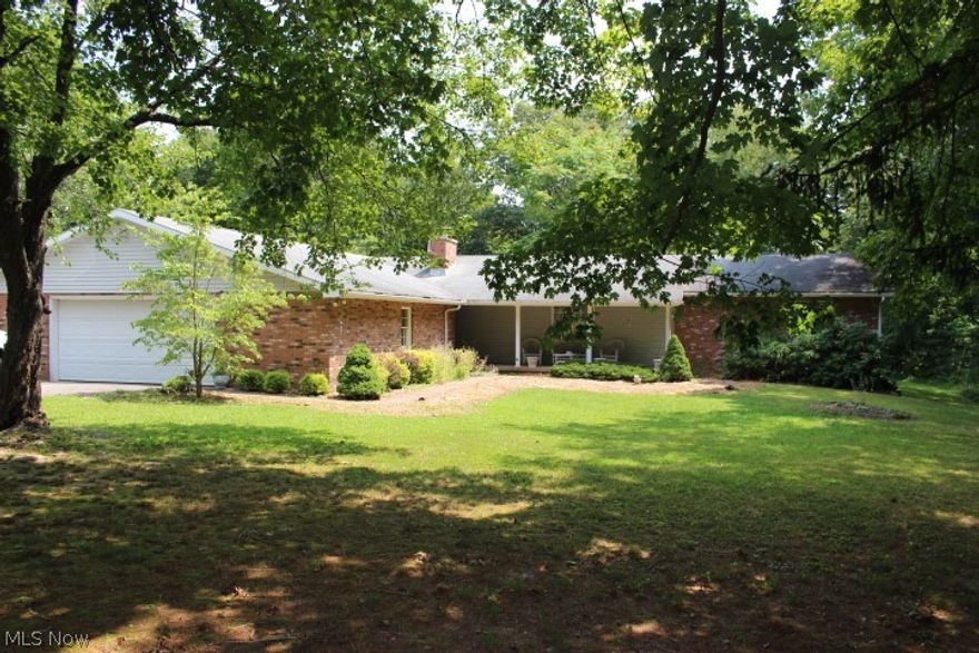 Huge Brick Ranch , Located on the Line of Warren LSD  and Belpre City  Schools.  This Sprawling Ranch has 2612 square  feet on the main floor!  There is a Large Sunken Living Room that is open to the Dining room.  The home has 4 bedroom ,  3 1/2 bath , Large Country Kitchen with Lots of cabinets, Laundry is on the main floor , Den or Office has a fireplace and is located off the family room, and a covered front porch for sitting in the evening. The home sits on 2.6 acre treed lot with lots of room to roam or plant a large garden.   Owners occupied the home for 32 years so don't miss your opportunity to make this your home.  Call today for your appointment.