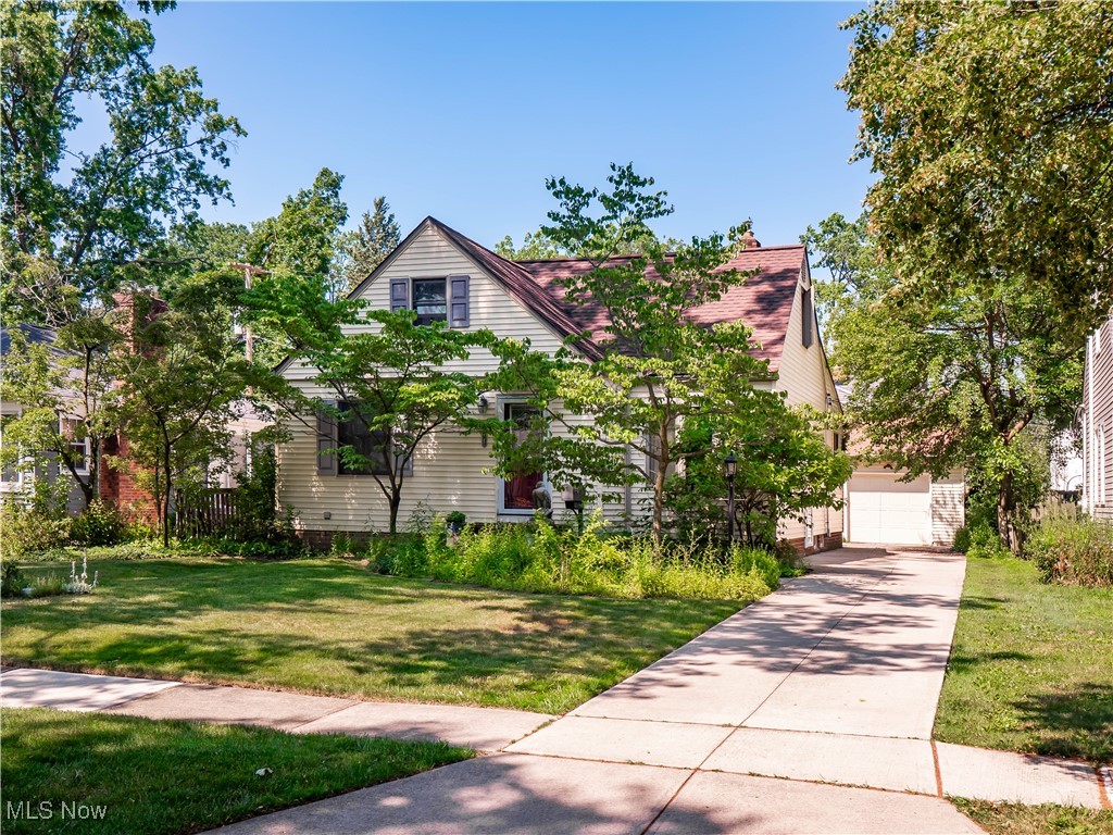 Discover 614 Parkside Drive—a beautifully updated 3-bedroom, 2-bath Cape nestled on a secluded Bay Village street. Outside you'll enjoy a private, fenced yard with mature landscaping, an elevated wood deck, and a brick patio that create the perfect outdoor retreat. An eat-in kitchen, thoughtfully added to the original footprint, showcases a vaulted ceiling with an exposed wood-wrapped beam, Corian countertops with an integrated sink, attractive cabinetry, tile backsplash and floors, stainless steel appliances, and breakfast bar. Also in the kitchen is a nice dining area, a built-in desk, and a sliding door that opens to the backyard. Original hardwood floors throughout the main level and both nice-sized 1st floor bedrooms. The main bath has been remodeled and includes a jetted walk-in tub. The staircase to the second floor showcases stained oak stair treads and a classic iron railing. Upstairs, you’ll find an oversized bedroom with a walk-in closet, two insulated knee-wall storage areas, and 20 (twenty!) built-in drawers. The professionally finished basement adds a large modern family room with recessed lighting, vinyl plank flooring, and a nice full bath. Notable updates include Andersen double-hung vinyl-clad windows, newer front and side doors with storm/screens, sliding vinyl basement windows, Carrier high-efficiency a/c and furnace with media cleaner, humidifier, and UV air purifier (2018), ultra-efficient tankless hot water heater (2024), new roof with transferable warranty (2016), LeafFilter gutter system, wood deck and brick patio (2022), newer concrete driveway, and an extra-wide garage built new in 2006 with overhead storage a man-door to the backyard. Enjoy a peaceful setting with easy access to local parks, Lake Erie, and all the amenities Bay Village has to offer. Don’t miss this updated and well-maintained, move-in ready home.