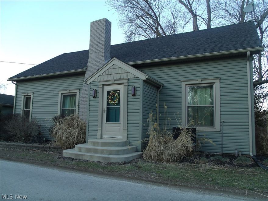 Country living only 8 miles from town! Charming one-story home situated on 4.38 acres. There are 2 two car garages on the property and an additional barn for storage. Beautiful park-like setting featuring water access and 500 Ft. of water frontage. Great area for hunting, fishing, and trail riding! Newer updates include windows, siding, trims, soffits, downspouts, French doors, storm door, and added insulation. 28 ft. pool with deck and newer pump. There is an additional electric, water, and septic that is separate from the house at the lower end of the property. Home is wired for a whole house generator.