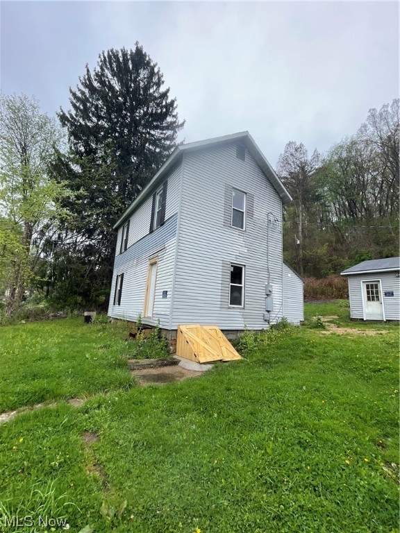 RENT JUST OUTSIDE OF TOWN: 1st mo/last mo and security deposit is required. This two story home features 2 bedrooms and 1 full bath. Detached 3 car garage with cement flooring and electric. This home sits on .33 acres just outside of town. Newer flooring installed, updated 200 amp electric. Call today for a private showing.