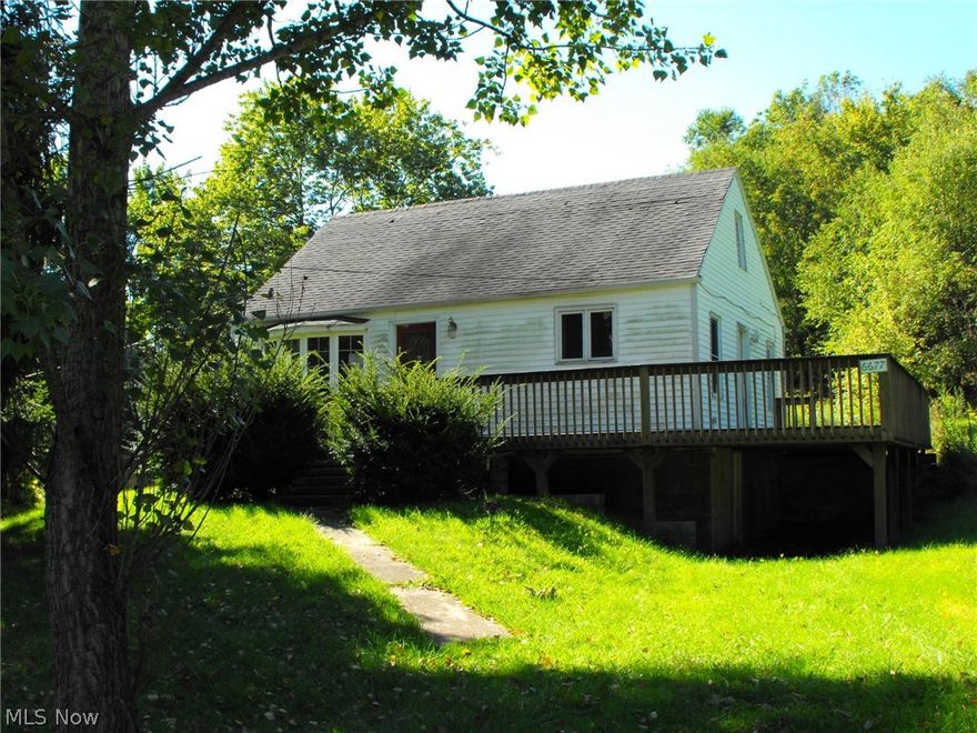Country Bungalow with deck in a quiet neighborhood. Fixer upper and ideal for fix and flip, or rental. Recent updates include: Front slope roof 5/17, Sump Pump 11/16, sewer parts replaced and filter 12/16, water pressure tank 12/16, electrical work 11/16, replace front roof 4/17, mold removal and treatment of roof 4/17.
Exterior work needed include gutter, front porch, doors, windows. Interior work needs dry wall, flooring.new carpet, fresh paint, update to bathroom and kitchen.
Agent owned  and sold "As Is". Willing to consider Land Contract with $7500 down.
