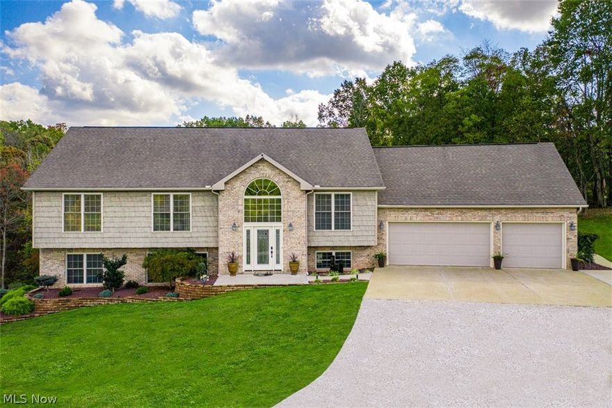 Town and Country location offers three acres of tranquility. This modern efficient floor plan has 3700 square feet of like new condition throughout. Handsome hardwood flooring leads to beautiful rooms complimented by an abundance of natural light and oversized windows that provide views of the meadow and woodlands. Multi level entry is inviting with palladium window and open staircase. The living and dining rooms are relaxed and casual. Gourmet style kitchen features furniture quality cabinets, quartz counters, professional stainless appliance package with dual fuel range, subway tile backsplash and walk out to an arbor covered raised 13x26 deck for dining. There are four bedrooms, three full baths and the 16x20 master is an ensuite. The home office could be a fifth bedroom. Lower level fireside family room with built-ins opens to13x26 covered patio and private wooded back. Laundry room is well planned with handsome hickory cabinetry, a folding area, industrial clothing rack, quartz co