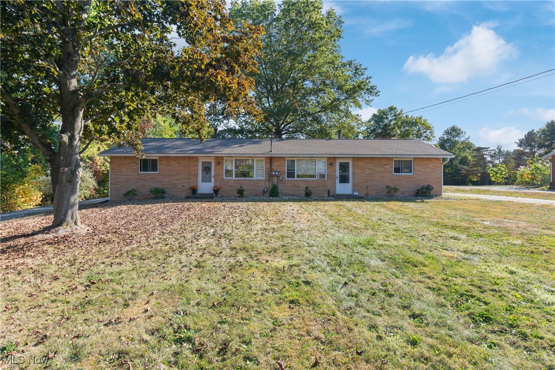 Meticulously maintained brick duplex. Same owner for 55 years. Nearly 1 acre private lot with room for expansion if desired and would make an excellent owner occupied investment property. Each unit has an eat-in kitchen, range, refrigerator, exhaust fan, 1st floor Laundry, Living Room and full Bath. Newer roof 2021 and updated mechanicals. Tenants use the carports in summer as covered porches. The 2-1/2 car garage has extra storage and is used by the tenant on the left (3300). Two separate driveways.