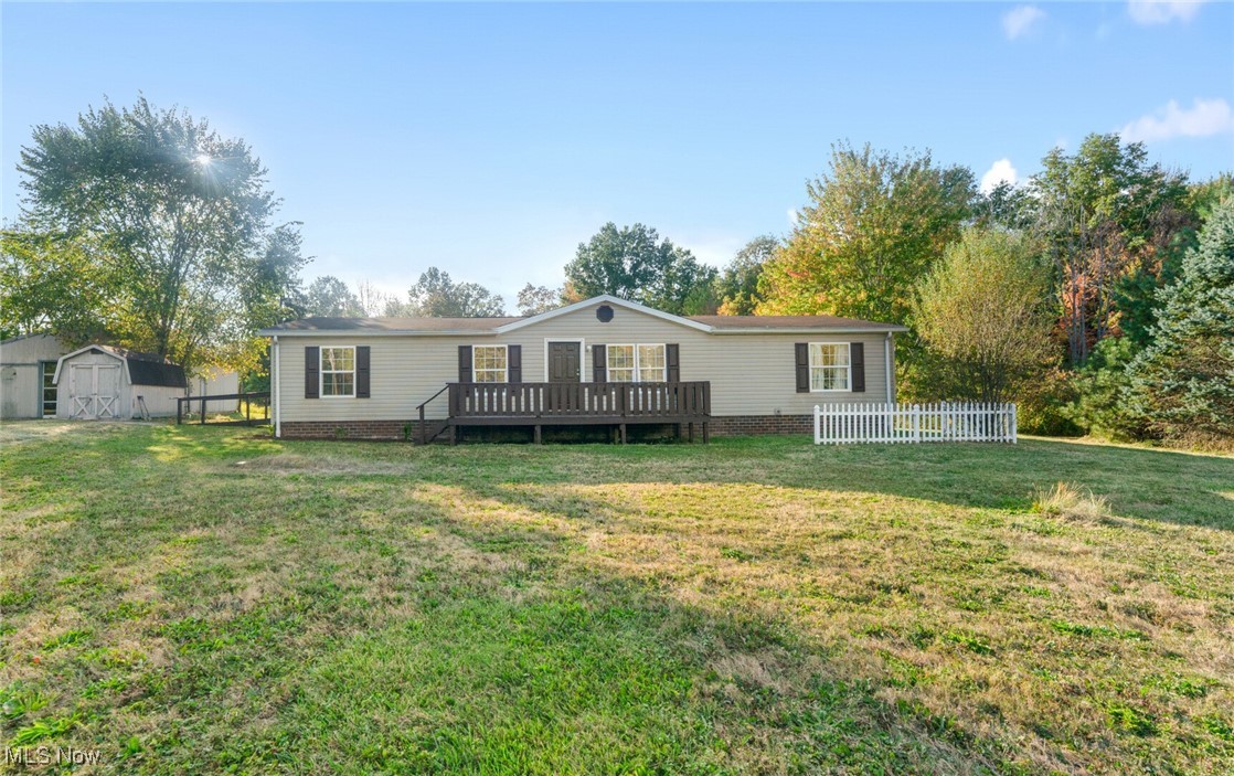 Welcome to 7518 Youngstown Salem Rd in Canfield! This beautifully updated 3-bedroom, 2-bath home sits on 11.5 picturesque acres in the Canfield Local School District. Step inside to find an open floor plan with a stunning kitchen featuring granite countertops, stainless steel appliances, tile backsplash, and a large center island that flows seamlessly into the spacious dining and living areas. The primary suite is a relaxing retreat with an en suite bathroom accented by a charming sliding barn door and a double vanity. Two additional bedrooms and a second full bath provide plenty of space for guests, a home office, or whatever suits your lifestyle. Convenient first-floor laundry, fresh paint, new flooring, updated lighting, and many more thoughtful updates make this home completely move-in ready. Outside, enjoy a large deck overlooking your serene property — perfect for entertaining or unwinding at the end of the day. A massive 28x32 garage with two bays and a generous storage/workshop area is ideal for vehicles, equipment, or hobbies. This home is a must-see — schedule your showing today!