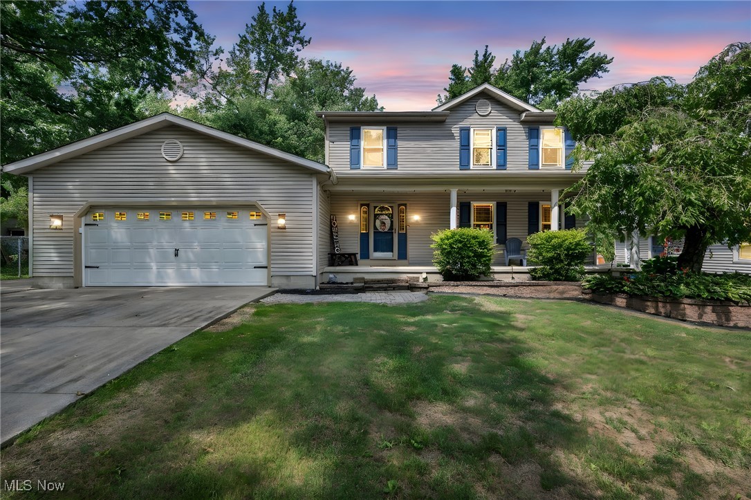 Welcome to this spacious Colonial just minutes from Springfield Lake in Akron, tucked away on a quiet dead-end street and sitting on a scenic .65-acre lot. The expansive backyard is a nature lover’s dream—featuring mature trees, a huge deck with covered gazebo, concrete patio, treehouse, large shed, and partially fenced yard (approx. 110' x 80'). Inside offers over 2,750 sq ft of finished space, including 3 large bedrooms, 3.5 baths, and a fully finished basement with full bath and bonus room. The main floor features a large living room, family room with patio access, and a beautifully updated kitchen with black granite sink (2021), butcher block island (2023), stainless steel appliances (2020), and peekaboo window to the family room. The dining room includes new vinyl flooring (2022) and sliding doors to the deck. Updated half bath on main level (2022). Upstairs you'll find two generously sized bedrooms, a full bath, and a spacious owner’s suite with remodeled private bath (2022). New carpet throughout (2021), vinyl flooring in dining/family rooms (2022), HVAC (2019), windows & slider (2018), and laminate in bedrooms (2017). Oversized 2-car garage with extra-wide driveway and RV/boat parking pad. Conveniently located near I-77, shopping, and restaurants—this home truly has it all! Schedule your private showing before someone else is calling this beauty “HOME”!
