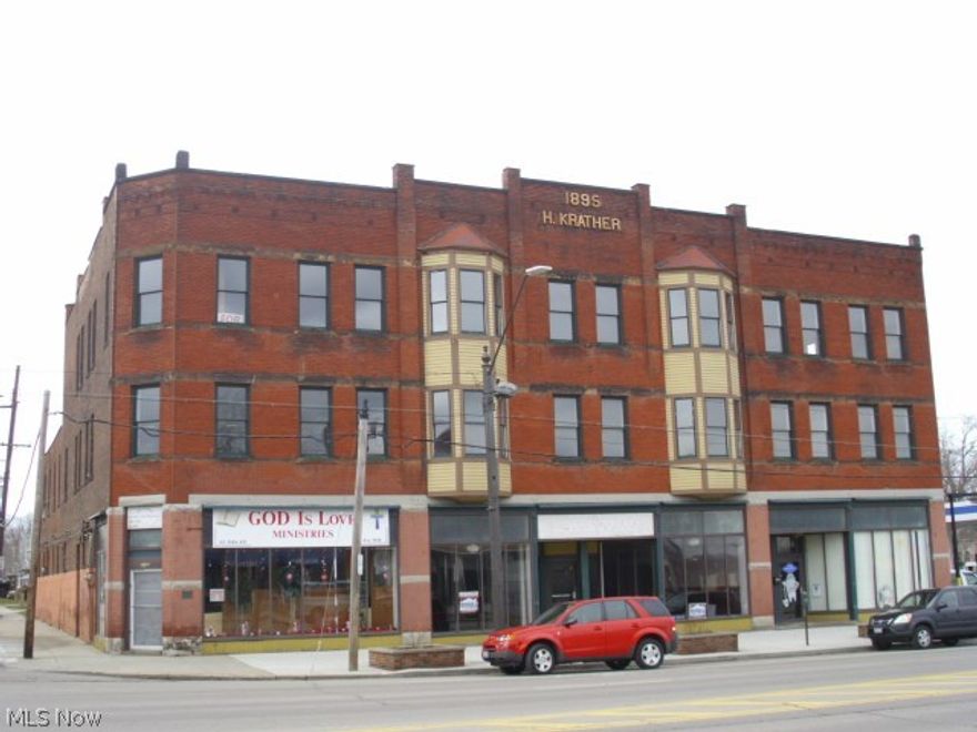 Three story brick building with lots of history!! The Krather Building on historic registry. Three parcels for parking in rear Three store fronts on first floor - two are currently rented. Newer roof, all new widows, newer furnaces in store fronts. Ten possible apartments! Third floor ballroom apartments, need to be finished. Two of the three first floor store fronts are currently rented as well as the back of the building. Full basement. Separate utilities and basement. Fabulous!!