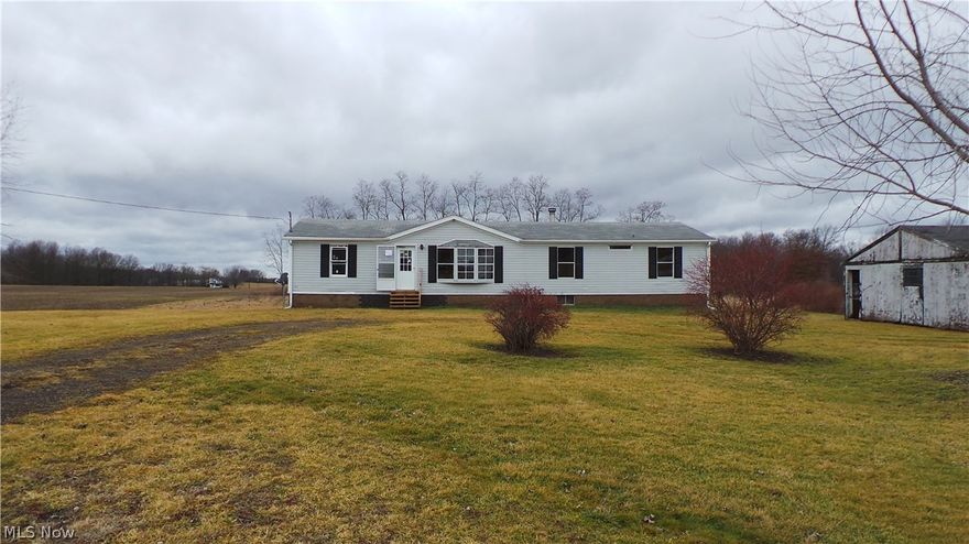 Located on a great county setting.  Property offers lots of living space, roomy kitchen w/lots of storage.  Large living room with two sided FP.  Three spacious bedrooms.  Huge garage space for four cars plus storage.  Lovely views.  Property sold AS IS.  Equal housing opportunity.