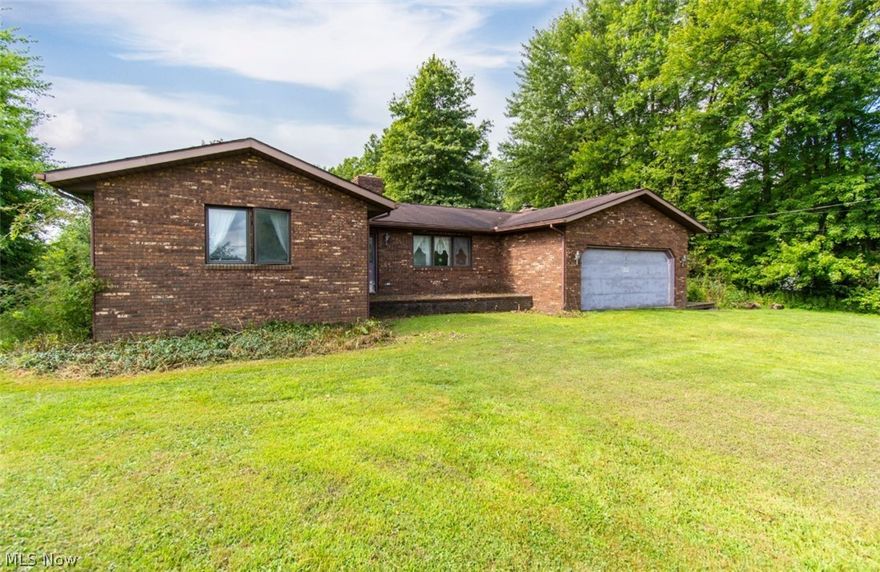 Don't miss out on this 3 bed, 2 bath Brick Ranch located in Bristolville. It has a wooden deck that runs down the side into a large open deck with a view of the quite and secluded back yard. Enjoy the nature of the 1 acre lot. Complete with a large 2 car garage with ample storage space. The living room and family room both feature beautiful fireplaces.