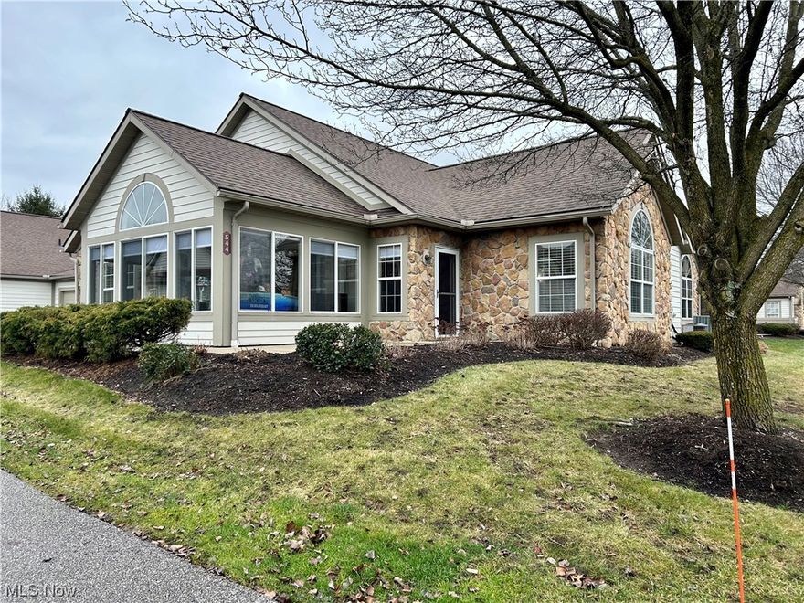 Ranch living at its best in the beautiful Crossings in Tallmadge! Maintenance free! Open concept 2 bedroom, 2 bath condo with living room, dining room, kitchen, and sunroom that could be used as an office or a den.  The living room has a gas fireplace and a vaulted ceiling. The kitchen is complete with a refrigerator, range, microwave, dishwasher, garbage disposal, and a breakfast bar. Both bedrooms have their own full bathroom. The laundry room is conveniently located off the kitchen with a washer and dryer included. Newer carpet and recently painted.  Attached 2 car garage. New roof 6/2023. New hot water heater.  Owners has access to the clubhouse, pool, exercise room, and a putting green.  A great walking neighborhood. Lots of shopping and restaurants nearby. Nothing to do but move right in!