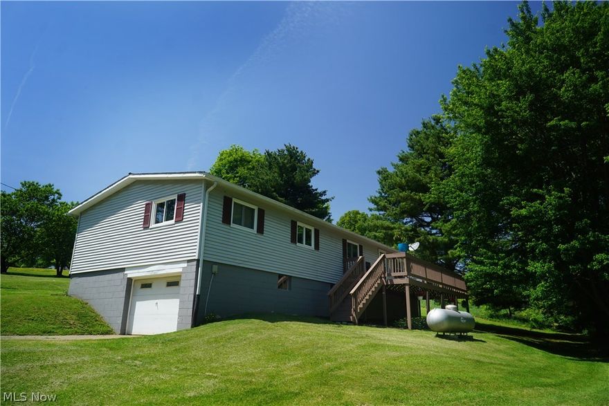 Nestled between trees and farms this home is waiting for the next owner to enjoy the quietness of back road living in Holmes County.  Home featuring 1,752 Sq Ft, 3 Bedrooms, 2 full baths.  Large front porch that leads into the foyer and dining room.  Huge living room that is great for entertaining!  Eat in Kitchen has an abundance of cupboards/ drawers, appliances will stay.  7X11 Pantry with exterior door to add convenience for unloading groceries.  First Floor Laundry is directly off the enclosed porch.  Master Bedroom with walk-in closet and bathroom.  Full unfinished basement with 1 bay garage.  This property sits on 1.46 acre.  Great location, minuets away from town.