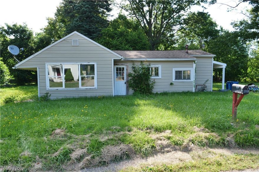 Welcome to 3205 Dewalt Dr, Akron, OH 44312 located minutes from highway access, Green school district. Great little neighborhood with surrounding properties well taken care of. This is a great fixer upper opportunity. Lot is oversized .856 acres with privacy all around. Shed out back, picnic table, covered back patio with concrete slab. Venal siding all around. Large family room dinning area off kitchen area. Three bedrooms in the back. Basement is great for storage or little work bench area. Seller is selling in "as is" condition will not make any changes or repairs. Cash only.