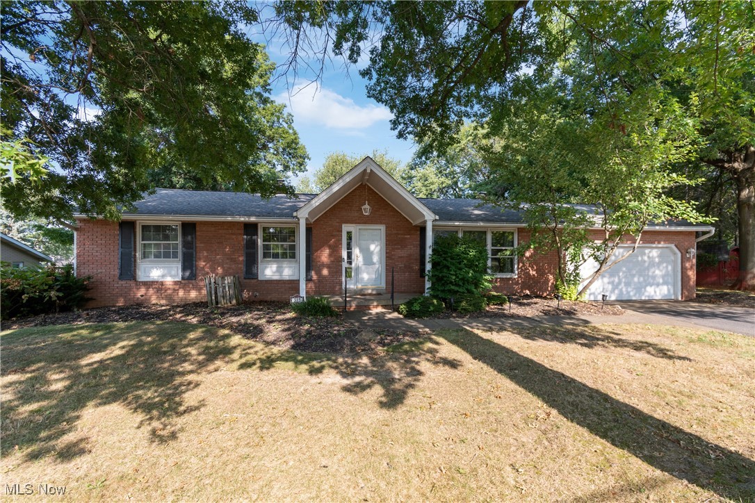 Welcome to this spacious 4-bedroom brick ranch home in Perry Township, offering comfort, versatility, and beautiful views. Step into the inviting entryway that leads to a bright living room with large windows, filling the space with natural light. The open-concept kitchen and dining area flow seamlessly onto a large deck, perfect for entertaining and overlooking a generous backyard. The home features a spacious primary bedroom with an ensuite bathroom, as well as a second potential primary bedroom with its own ensuite, providing flexibility for family, guests, or a future in-law suite. Two additional bedrooms and an updated full bathroom complete the main level. The lower level offers a welcoming rec room with a fireplace and a walk-out basement that leads to a patio beneath the deck. With ample storage and plenty of room for additional living space, this level adds both function and opportunity to the home. A two-car attached garage provides convenience, while the layout and features make this property ideal for a variety of living arrangements. With its thoughtful design, multiple ensuite bedrooms, and fantastic backyard views, this home is full of potential and ready to be your next chapter. Ideally located near Sippo Lake Park with its scenic trails, as well as shopping, restaurants, and everyday conveniences. Schedule your showing today!