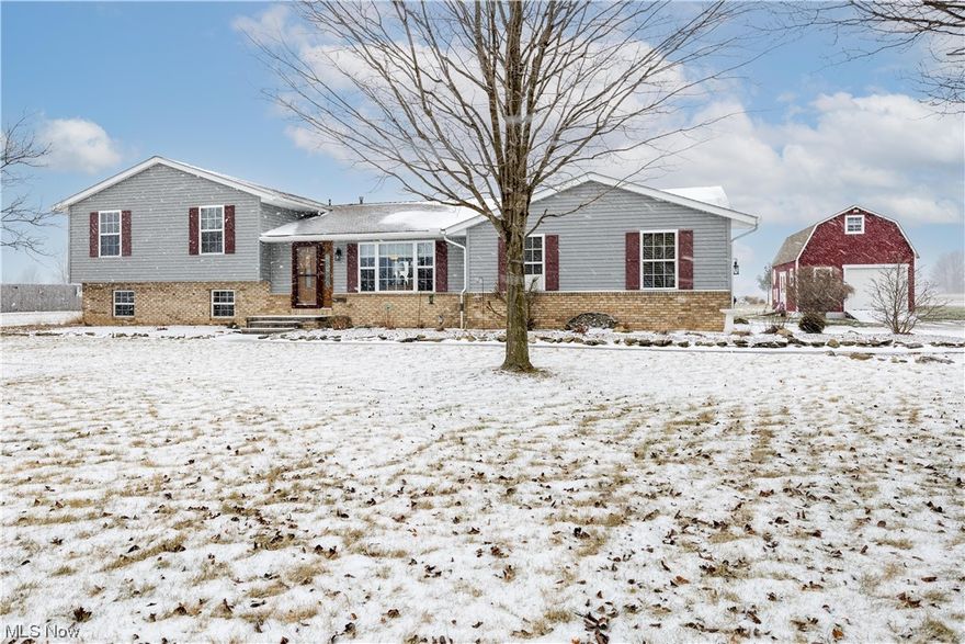 Curb appeal matters. As you enter the long, extra wide, driveway, you will notice how the home sits far from the street, along with a side loading garage. There is also a large, 2 story, outbuilding (17x24). All of this is nestled in a prime location of Amherst Twp. This lot (1.09 acres) provides the perfect location to relax, enjoy views, and the beautiful sunset. As soon as you enter this immaculately maintained, split level home, it screams pride in ownership! This spacious four bedroom, 3 full bath home has an open concept feel, perfect for entertaining inside and out. This split level has a partiality finished basement for additional storage, and is hard wired for fire/safety throughout the home. You can expect to find a large, eat in kitchen that has all stainless steel appliances that will convey, & granite counter tops. The 3 car garage has a work shop, is tastefully painted, & has epoxy finished floors. The layout of this home has an option for an in-law suite or teen suite. The possibilities are endless. Feel at ease that not only is this home well taken care of, but it is definitely move in ready. Many updates/new mechanicals, etc. Please see the additional supplement in MLS. Call for your private tour, because this one will not last!