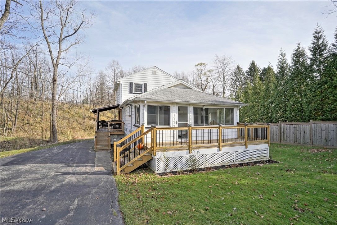 Looking for all the nature lovers! Take a look at the self guided tour in the link above! Nestled along a gently sloped hill and creek, and away from the road, this adorable home has all the wildlife that comes along with owning a nearly 3 acre wooded property. The home features 3 bedrooms, plus a bonus area (office? playroom?), and an enclosed porch. This has all the "feels" of the modern farmhouse, and is ready for the new owner. Current owners have an opportunity to move closer to family, and are leaving this slice of paradise in the city. With decks on 3 sides of the home, you can always find a place to sit and enjoy the tranquility. The back yard has a little bridge to cross the creek to take you to the other side of the property. Up over the hill is a flat couple acres ready for your own ideas. Newer items include the septic system, windows, AC and more.